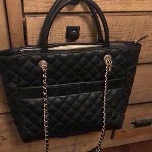 Black quilted tote/satchel purse in a great condition. Looks new